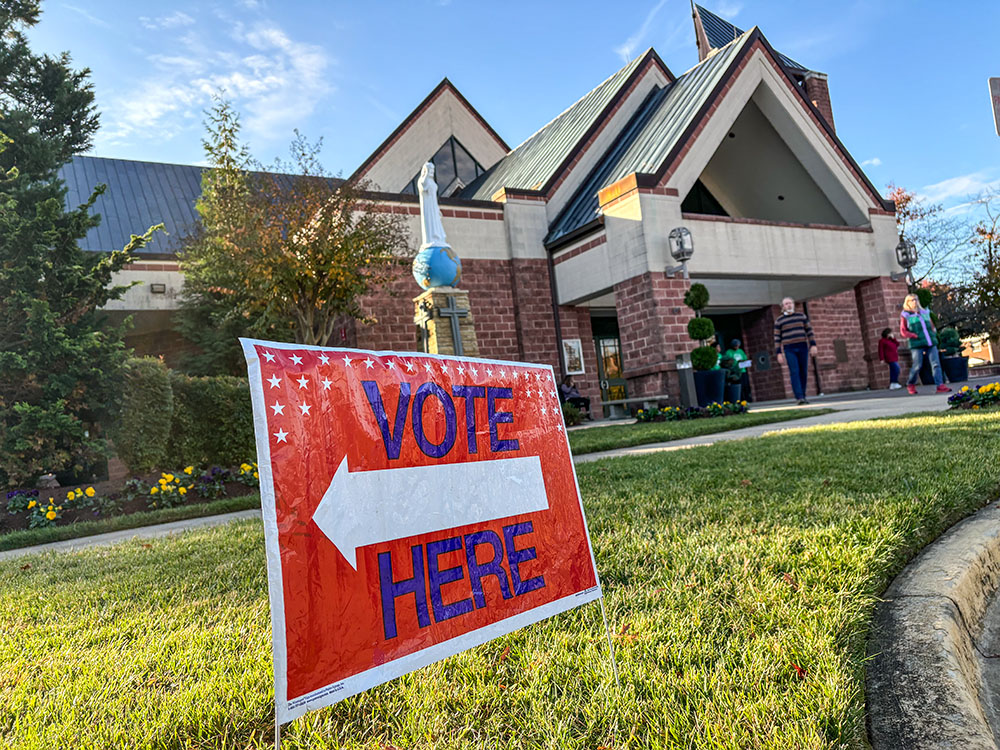 A voting sign is posted in front of St. Mark the Evangelist Catholic Church, a polling location in Hyattsville, Md., on Election Day in 2024. (NCR photo/James Grimaldi)