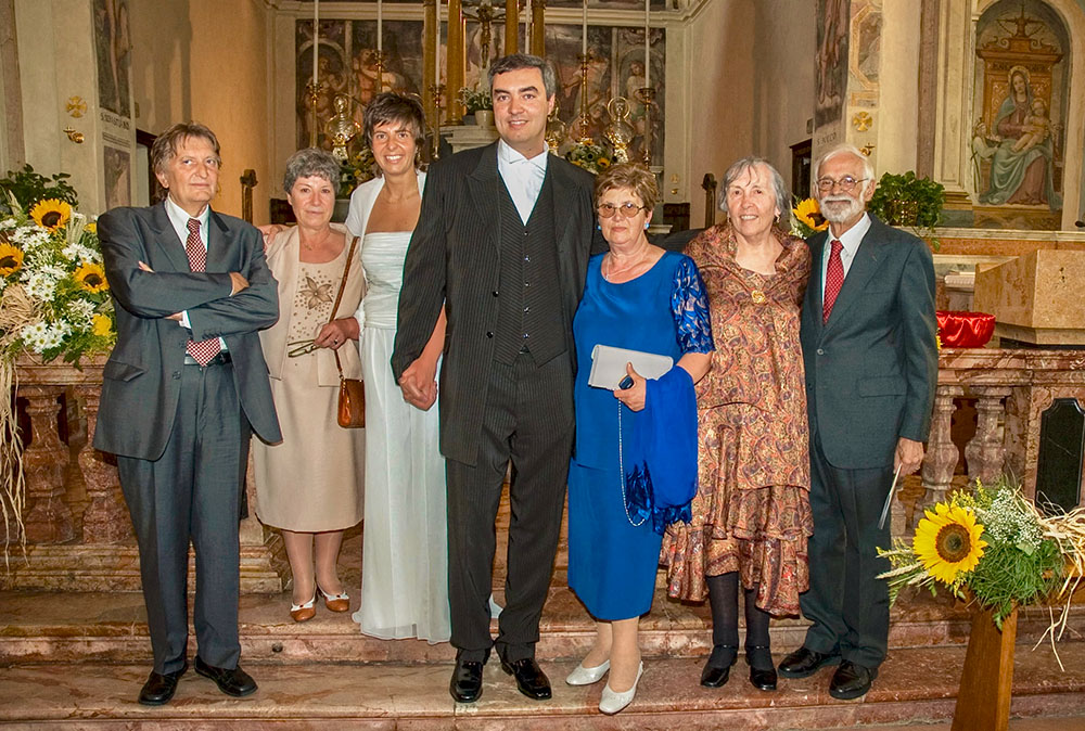 John Campitelli at his wedding in June 2005, with his reunited Italian birth mother, Francesca (in the blue dress), and his American adoptive parents, Barbara and Russell (last two on the right). "It was the first time that my biological family met my adoptive family," he said to NCR. (Courtesy of John Campitelli)