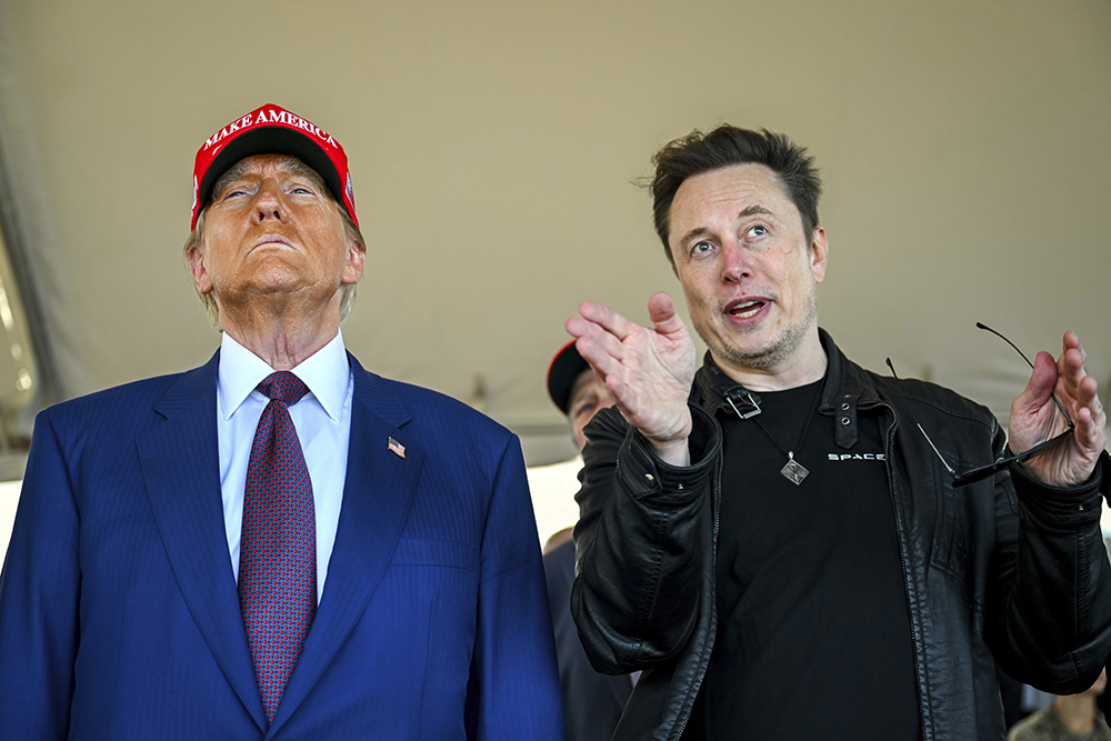 President-elect Donald Trump listens to Elon Musk as he arrives to watch SpaceX's mega rocket Starship lift off for a test flight from Starbase in Boca Chica, Texas, Nov. 19, 2024. (Brandon Bell/Pool via AP, File)