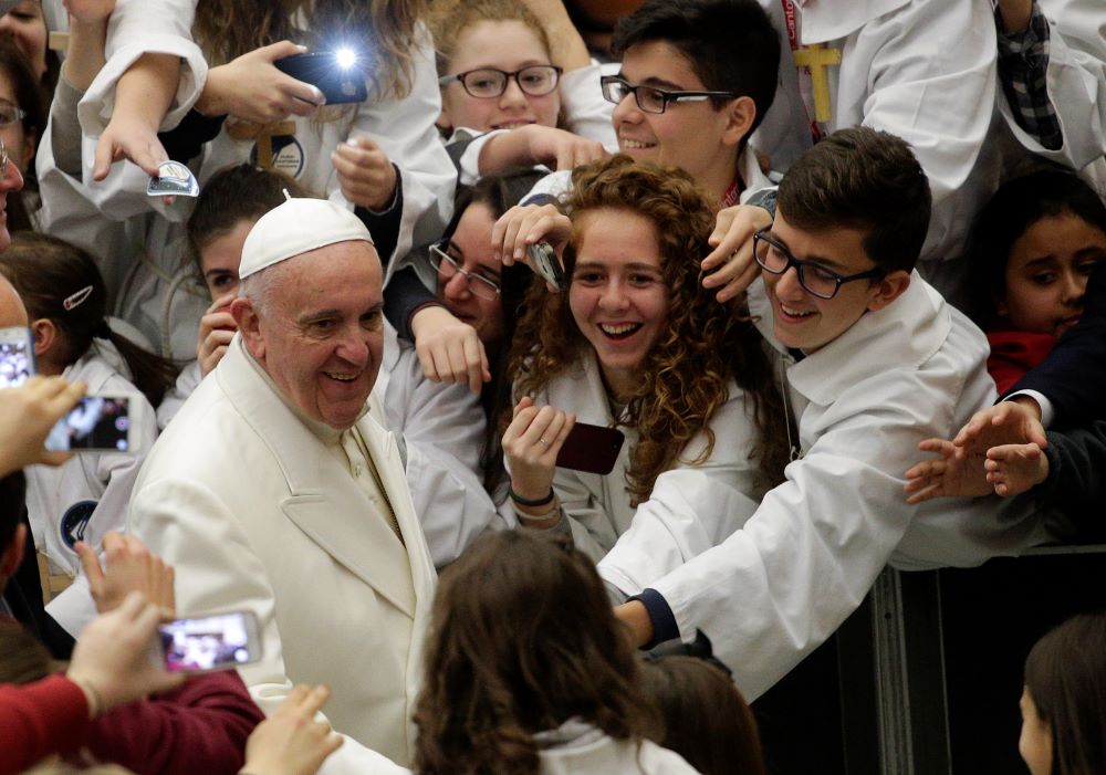 Pope Francis arrives to lead a special audience with the International Congress of Pueri Cantores in Paul VI audience hall at the Vatican Dec. 31, 2015. (CNS/Reuters/Max Rossi)