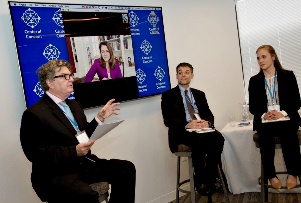 From left: Kevin Locke, Kerry Alys Robinson (onscreen), Massimo Faggioli and Jordan Denari Duffner discuss the pontificate of Pope Francis March 13 at Center of Concern headquarters in Washington, D.C. (Center of Concern/Michael Carpenter Photography)