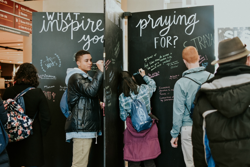 Attendees add prayer intentions and inspirational phrases to a display at the Student Leadership Summit, sponsored by the Fellowship of Catholic University Students in Chicago Jan. 2-6. (Courtesy of FOCUS)