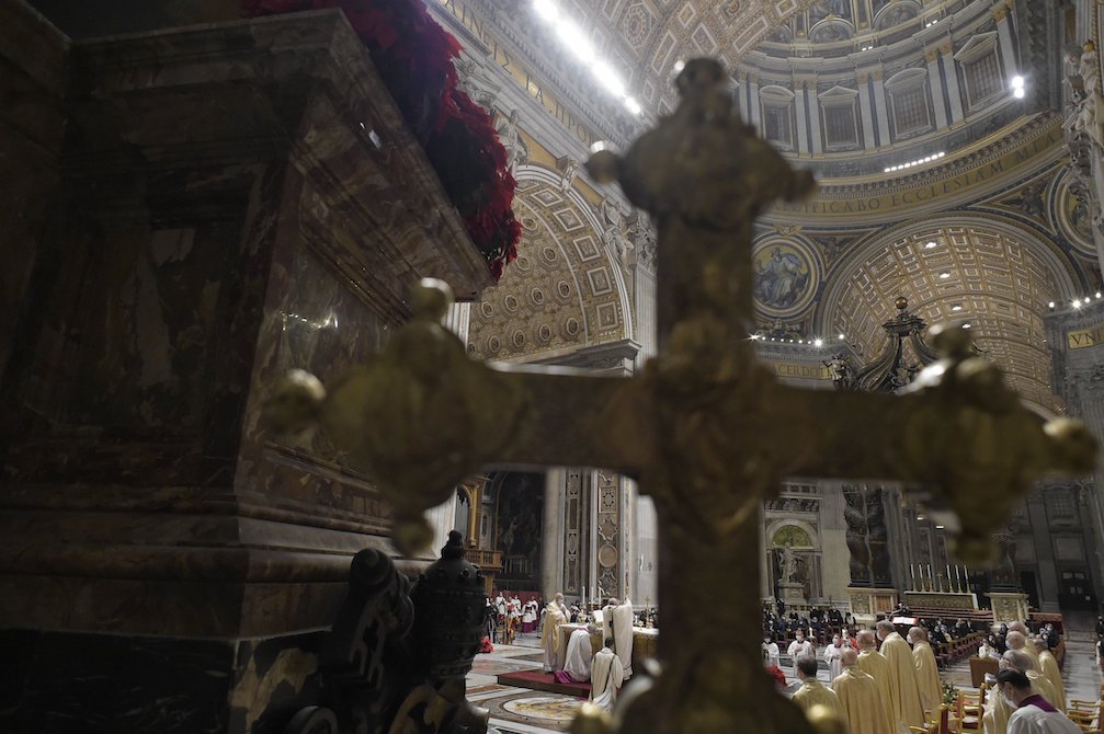 A cross is seen as Pope Francis celebrates Christmas Eve Mass, which was not open to the public, in St. Peter's Basilica at the Vatican Dec. 24, 2020. (CNS/Vatican Media)