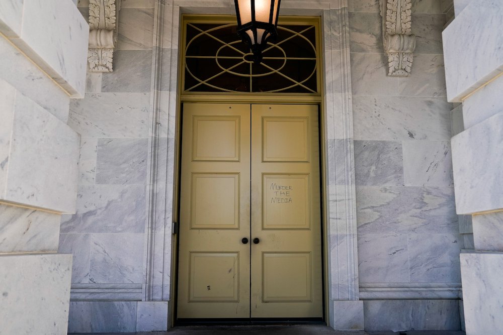 The phrase "Murder the media" is seen written on a door to the U.S. Capitol in Washington Jan. 7, 2021, one day after supporters of President Donald Trump breached the U.S. Capitol. (CNS/Reuters/Erin Scott)