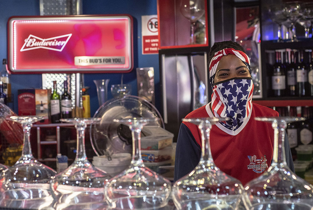 A bartender wears a face mask to protect against COVID-19 at the Mustang Sally Restaurant in Pretoria, South Africa, on Nov. 4, 2020, the day of the U.S. presidential election. (AP)