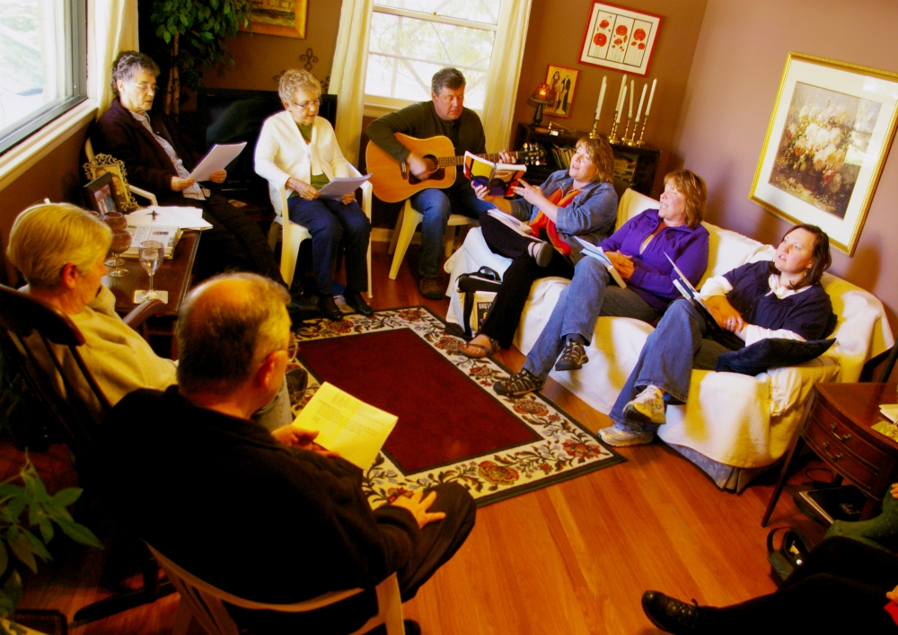 Members of the Call to Action group in Lincoln, Nebraska, sing in a prayer liturgy during a 2012 meeting at the home of Rachel Pokora. (NCR photo/Joshua J. McElwee)