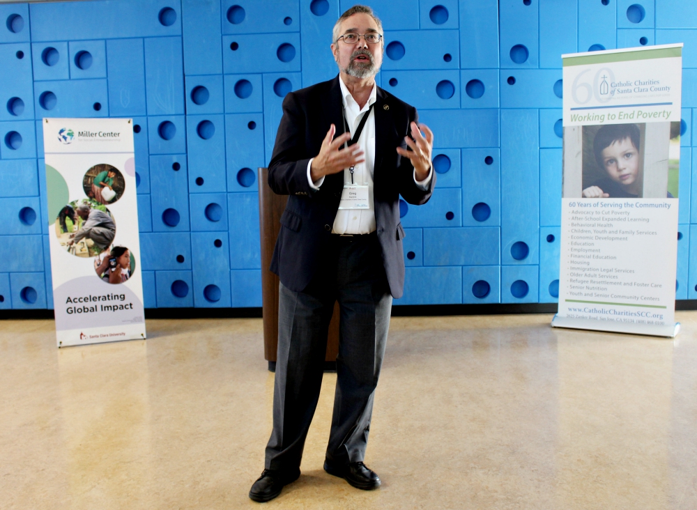 Gregory Kepferle, CEO of Catholic Charities of Santa Clara County, gives a speech before the final presentations at the San Francisco Bay Area GSBI Boost in San Jose, California. (Heather Adams)