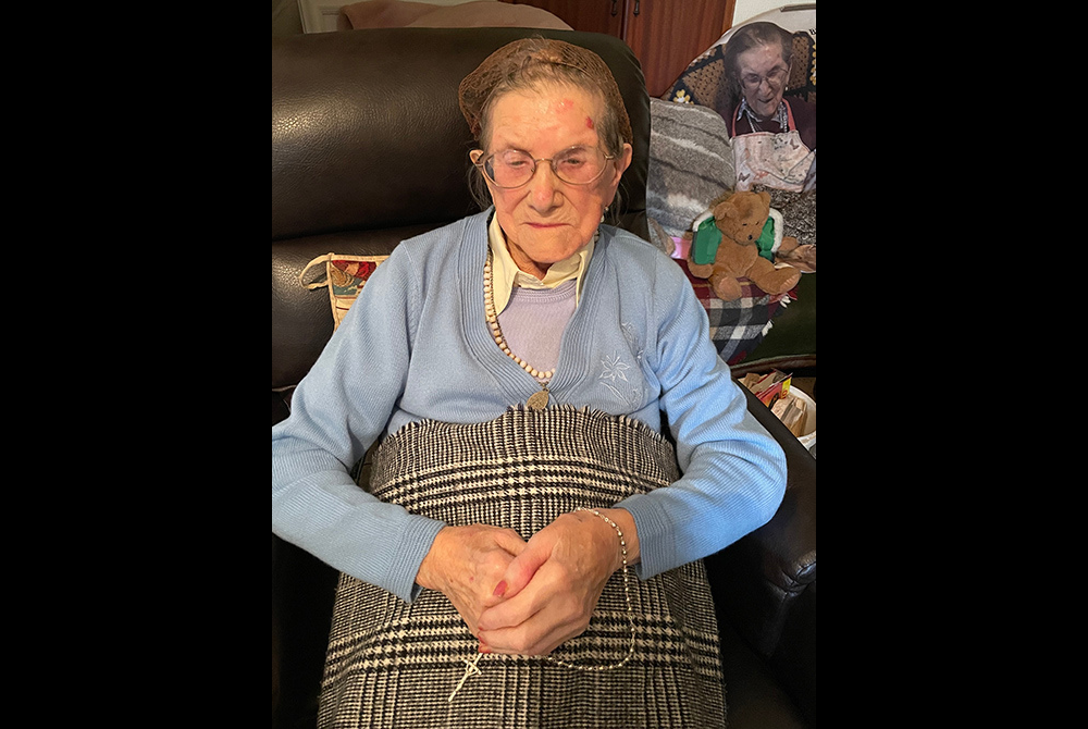 Nancy Stewart seen with her rosary beads inside her house in Clonard, County Meath, Ireland (Courtesy of Louise Coghlan)