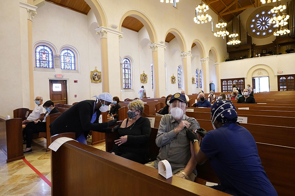 Diane and Jack Leahy of Miami Lakes, Florida, receive the second dose of the Moderna COVID-19 vaccine at St. Patrick Catholic Church March 1, 2021, in Miami Beach.