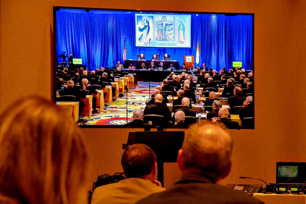 Journalists watch a live feed of the Nov. 12 fall general assembly of the U.S. Conference of Catholic Bishops in Baltimore. (CNS/Catholic Review/Kevin J. Parks)