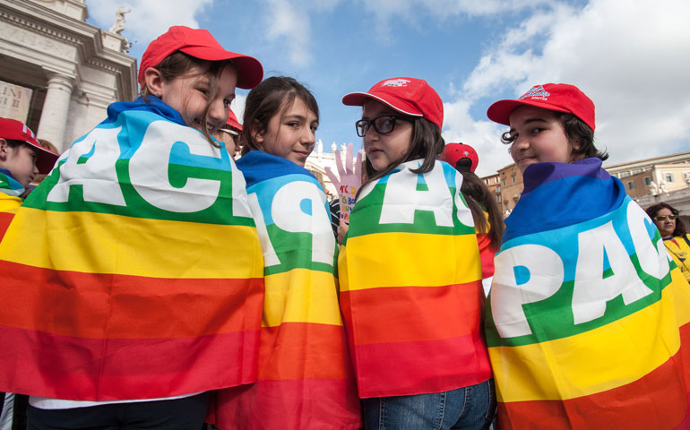 Young people wear peace flags in St. Peter's Square at the Vatican in May 2014. (Newscom/CPP/Polaris/Massimiliano Migliorato)