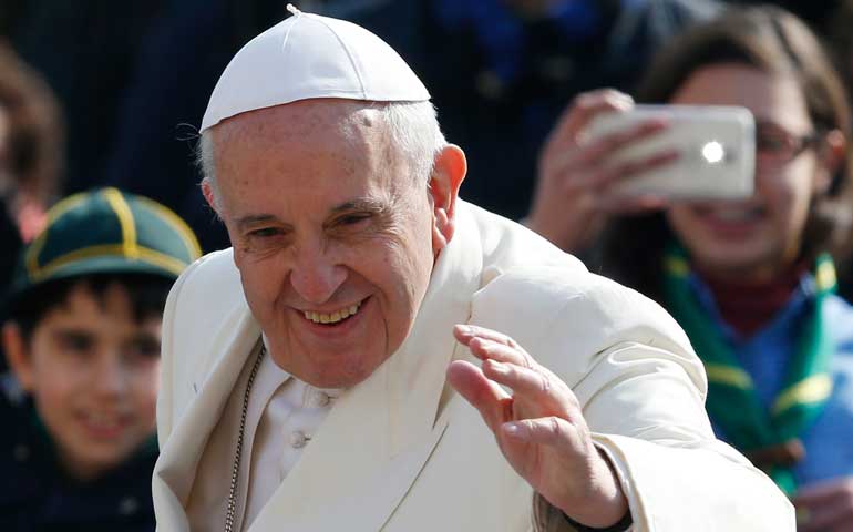 Pope Francis waves as he arrives to lead his general audience in St. Peter's Square at the Vatican March 11. (CNS/Paul Haring)