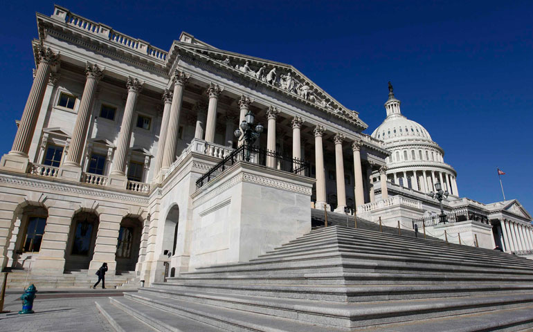 The U.S. Capitol dome is seen behind the entrance to the House of Representatives on Capitol Hill in Washington. (CNS/Reuters/Larry Downing)