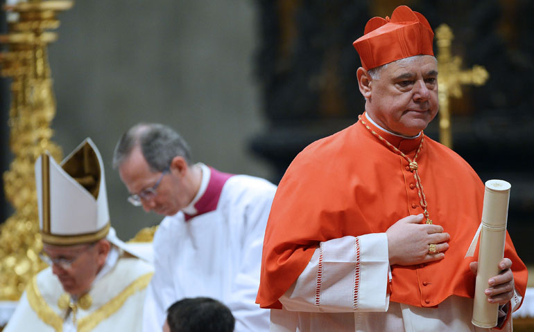 With Pope Francis at left, Cardinal Gerhard Müller, right, is seen at the consistory in which he was made a cardinal in St. Peter's Basilica at the Vatican Feb. 22. (AFP/Getty Images/Vincenzo Pinto)