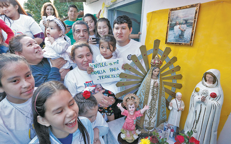 People wait for Pope Francis' arrival to Bañado Norte, a poor neighborhood in Asunción, Paraguay, July 12. (CNS/Paul Haring)