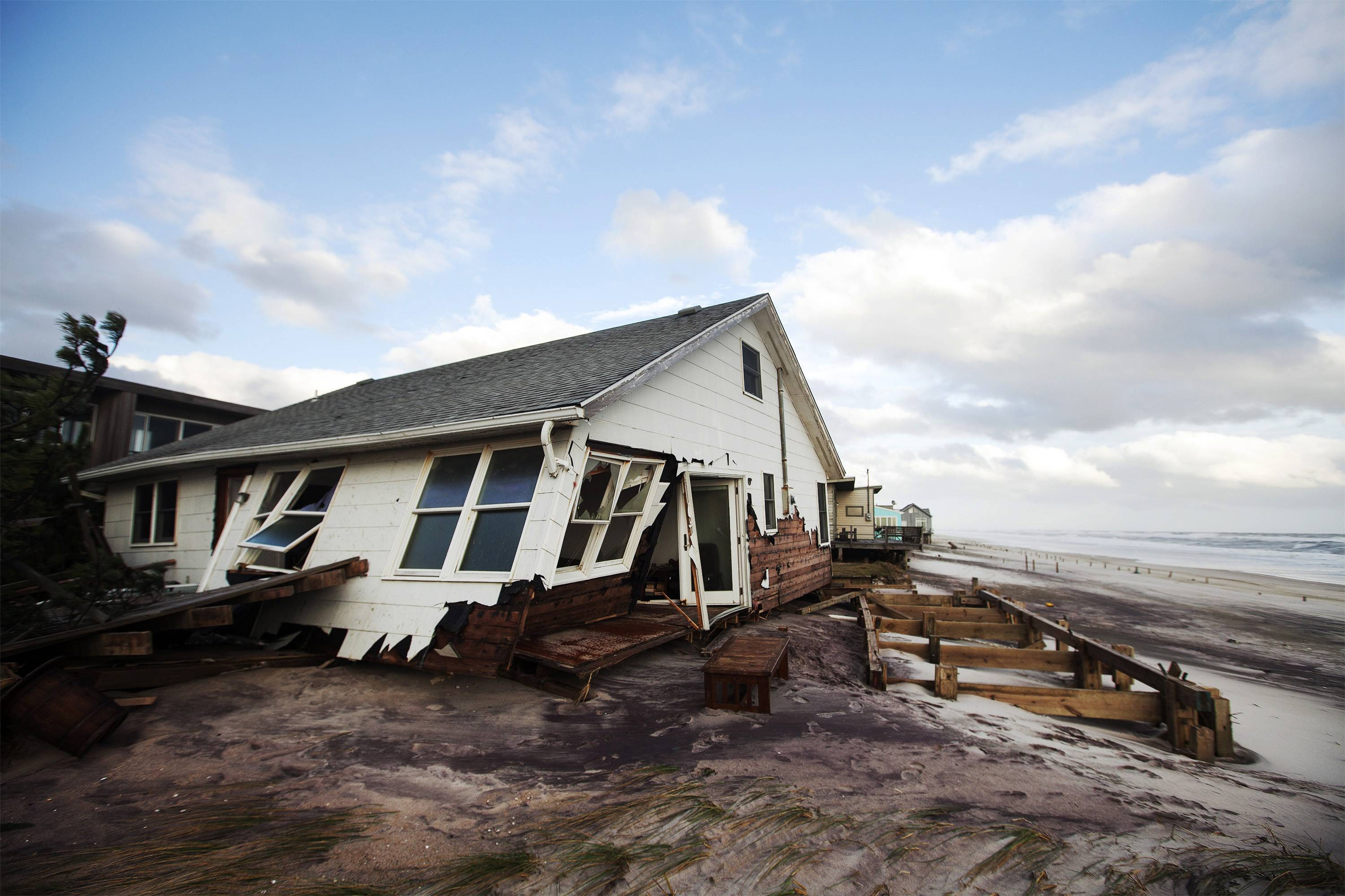 A destroyed house is seen Oct. 31 after Hurricane Sandy passed through Atlantique on Fire Island, N.Y. Millions of people across the eastern United States awoke to scenes of destruction wrought by monster storm Sandy, which knocked out power to huge swa thes of the nation's most densely populated region. (CNS photo/Lucas Jackson, Reuters)