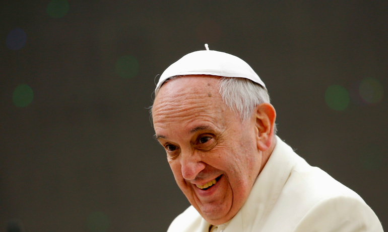 Pope Francis smiles after leading his general audience in St. Peter's Square at the Vatican Feb. 26. (CNS/Reuters/Tony Gentile)