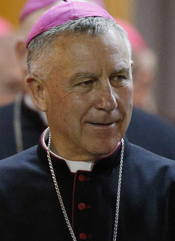 Archbishop John Atcherley Dew of Wellington, New Zealand, leaves a meeting of the Synod of Bishops for the new evangelization at the Vatican in this Oct. 10, 2012, CNS file photo. Dew, 66, was one of 20 new cardinals named by Pope Francis Jan. 4. (CNS photo/Paul Haring)