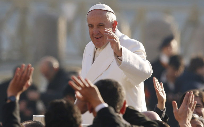 Pope Francis greets the crowd during his general audience in St. Peter's Square at the Vatican Dec. 16. (CNS/Paul Haring)