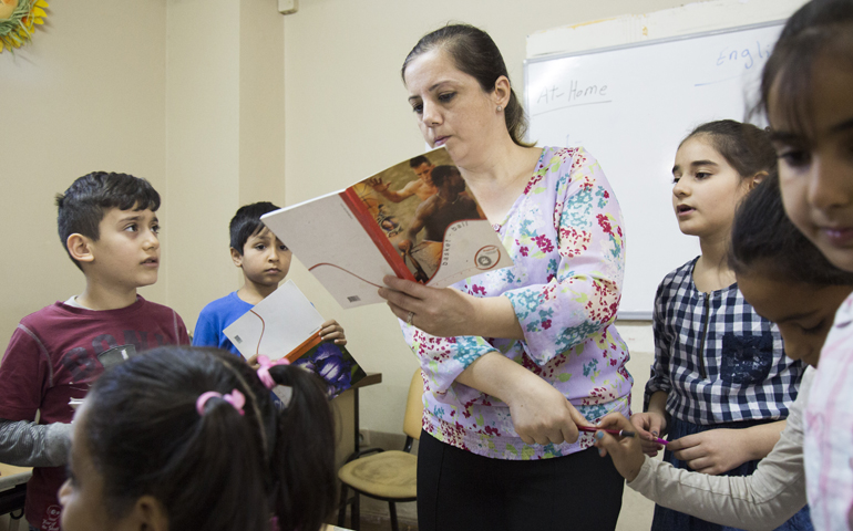 Basima Kamil, 42, a refugee from Iraq, teaches English Oct. 3 at the Don Bosco Youth Center in Istanbul. (CNS/Oscar Durand)