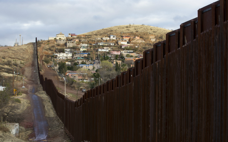 The bollard steel border fence splits the U.S. from Mexico in this view west of central Nogales, Ariz., Feb. 19. (CNS photo/Nancy Wiechec)