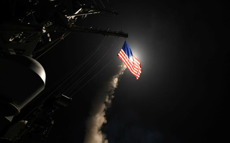 The USS Porter, in the Mediterranean Sea, fires a Tomahawk missile April 7. (CNS/Reuters/U.S. Navy handout/Ford Williams)