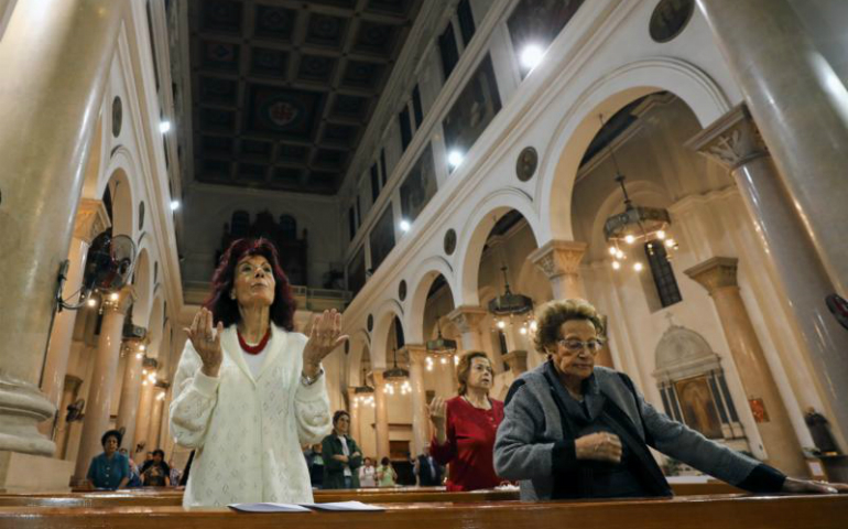 Women pray during Mass April 25 at St. Joseph's Catholic Church in Cairo ahead of Pope Francis' April 28-29 visit. (CNS photo/Mohamed Abd El Ghany, Reuters)