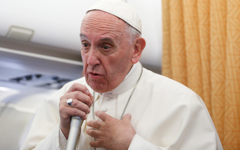 Pope Francis speaks to journalists aboard his flight from Cairo to Rome April 29. (CNS/Paul Haring)