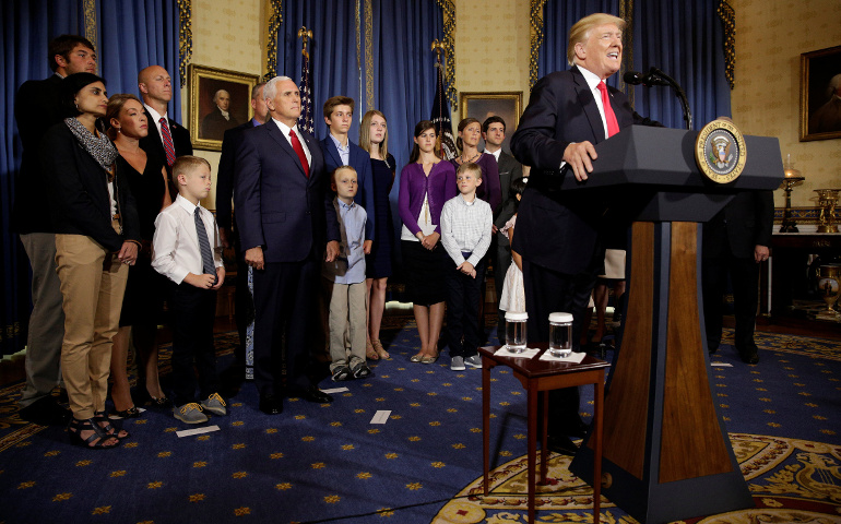 President Donald Trump talks about health care reform in the Blue Room of the White House in Washington July 24. (CNS/Joshua Roberts, Reuters)