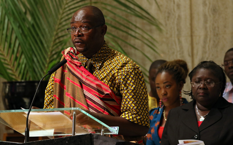 Ugandan-born Pius Bugembe, a religion teacher at Cardinal Hayes High School in the Bronx, N.Y., reads one of the general intercessions in Swahili during a special evening prayer service June 29 at Holy Family Church in New York City. (CNS/Gregory A. Shemitz)