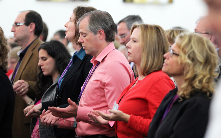 Attendees of Catholic Charities USA's annual gathering in Charlotte, N.C., pray during an Oct. 5 Mass at St. Joseph Vietnamese Catholic Church. (CNS/Patricia L. Guilfoyle)