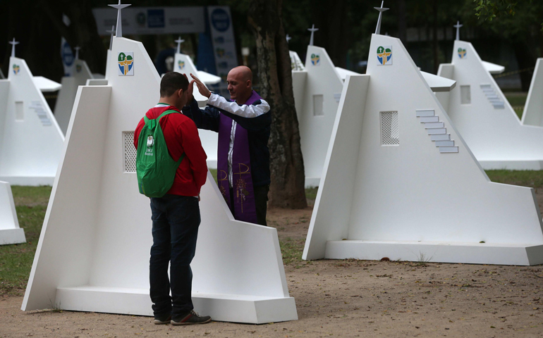 A pilgrim goes to confession July 23, 2013, during World Youth Day in Rio de Janeiro. (CNS/EPA/Marcelo Sayao)