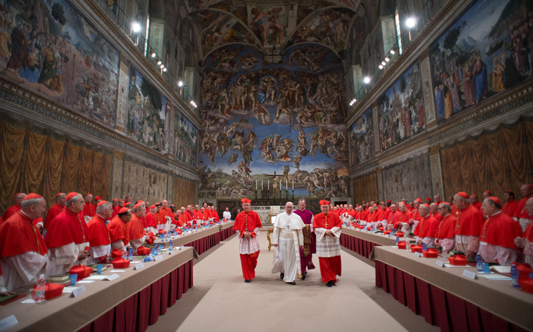 Pope Francis leaves the Sistine Chapel after being elected pope and shortly before appearing for the first time on the central balcony of St. Peter's Basilica on March 13 at the Vatican. (CNS/L'Osservatore Romano) 