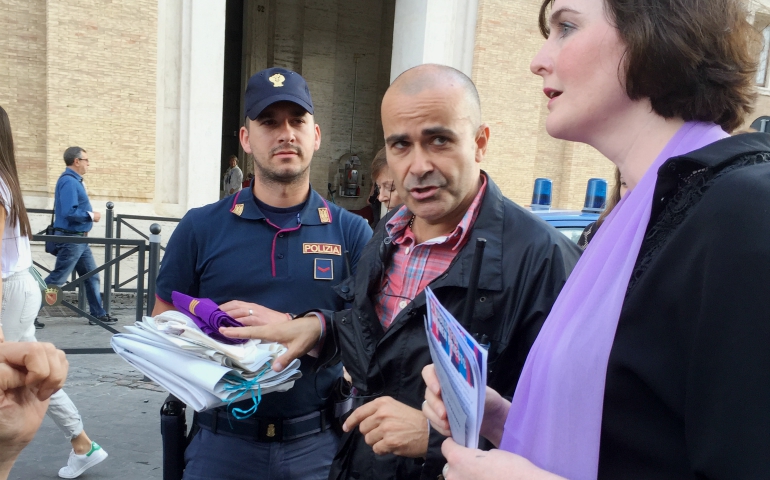 Women witnesses' stoles, posters and buttons were confiscated and held by the police for the duration of the papal Mass for the Jubilee for Priests in June 2016. (Jamie Manson)