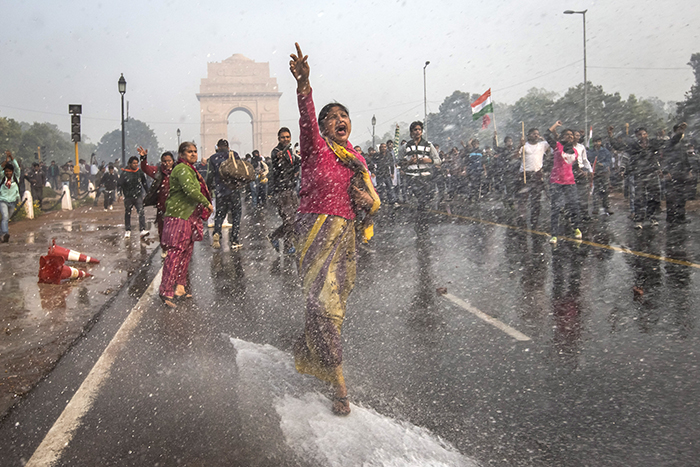 Scene from "India's Daughter," showing women protesting rape culture in India and being sprayed by waterhoses wielded by the authorities. (Leslee Udwin)