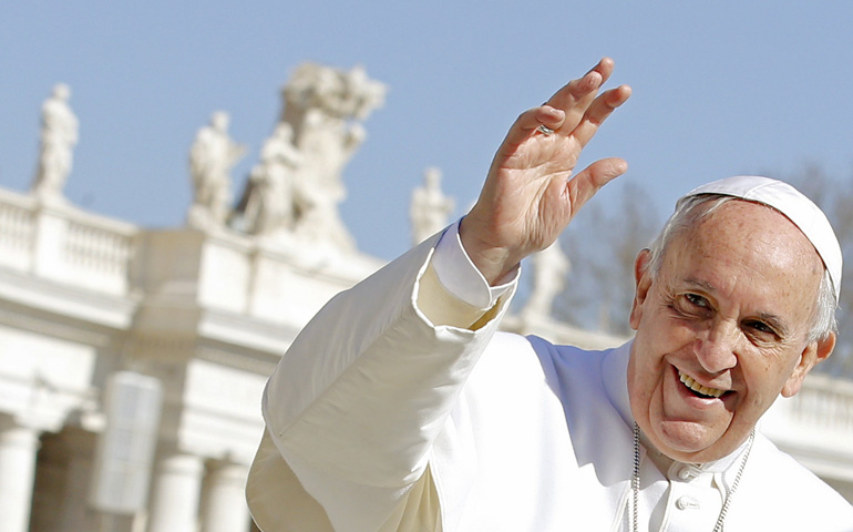 Pope Francis waves as he leads the weekly audience Wednesday in St. Peter's Square at the Vatican. (CNS/Reuters/Giampiero Sposito)