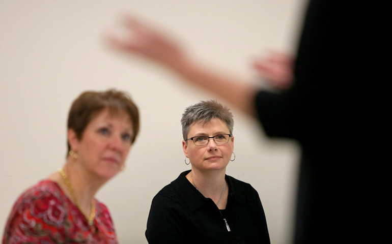 Julie Mercer-Kidd, left, director of Mission Services at Mercy Hospital in Springfield, and Tracey Biles, vice president of mission at Mercy Hospital in Ada, Okla., attend a class at the Aquinas Institute of Theology on Feb. 13 in St. Louis. (RNS/Courtesy of St. Louis Post-Dispatch/Huy Mach)