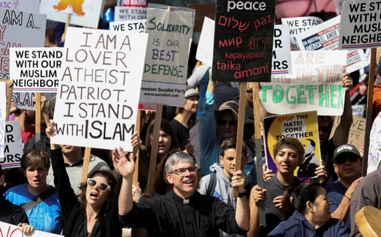 Counterprotesters hold signs and shout slogans during an anti-Shariah rally in Seattle on June 10, 2017. (Courtesy of Reuters/David Ryder)