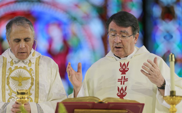 Cardinal Daniel N. DiNardo of Galveston-Houston, president of the U.S. Conference of Catholic Bishops, and Archbishop Christophe Pierre, apostolic nuncio to the United States, concelebrate Mass July 4. (CNS photo/Bob Roller)