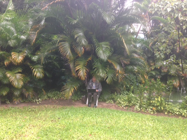 NCR's John Allen seeks shelter from the rain at Rio de Janeiro's City Palace