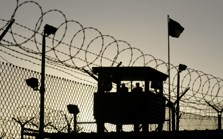 U.S. Army troops stand guard over Sally Port One at Camp Delta where detainees are held in Guantanamo Bay, Cuba. (CNS photo/Joe Skipper, Reuters)