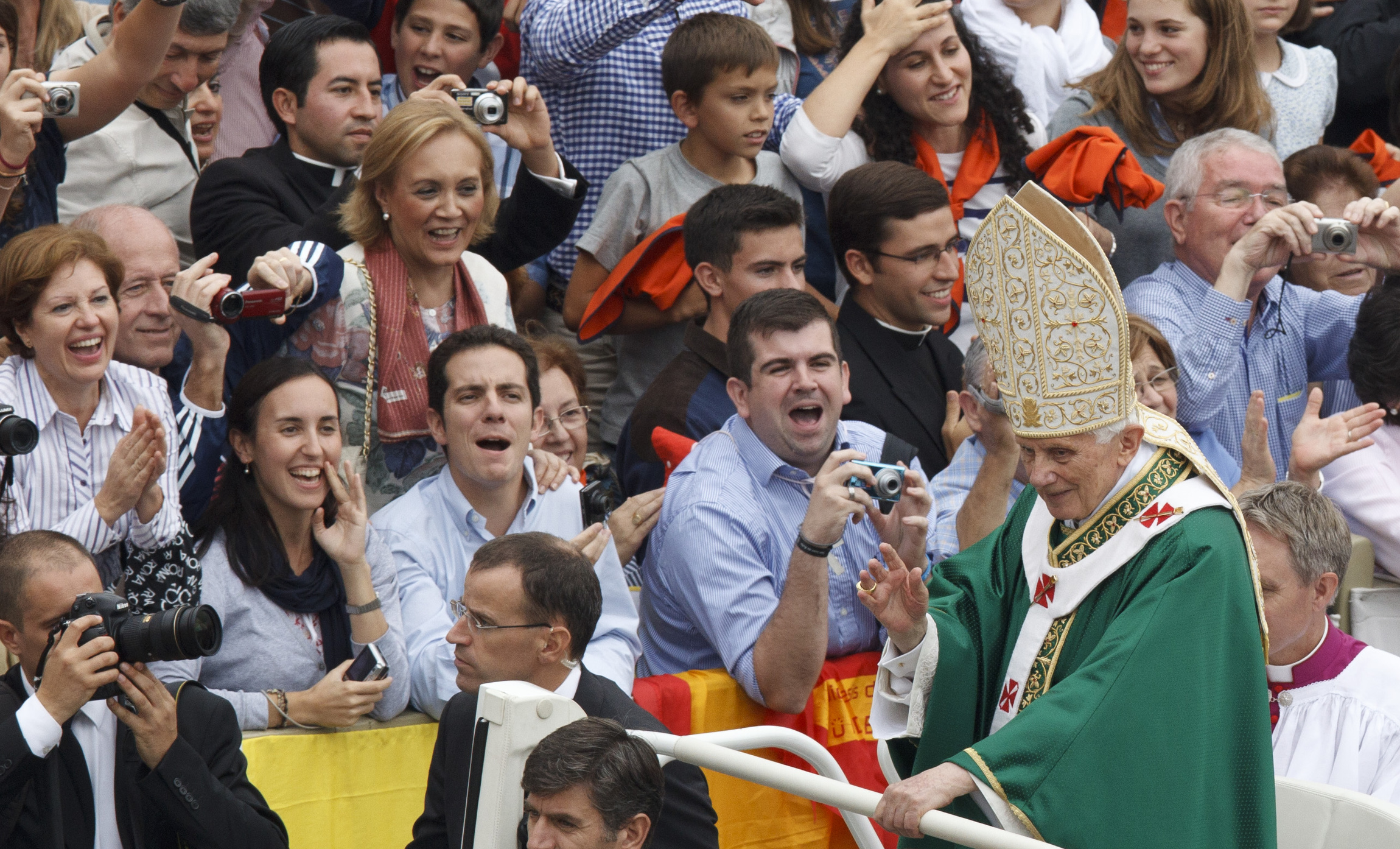 Pope Benedict XVI greets the crowd after celebrating the opening Mass of the Synod of Bishops on the new evangelization in St. Peter's Square at the Vatican Oct. 7. (CNS photo/Paul Haring)