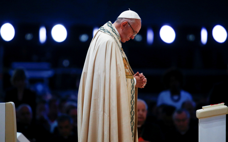 Pope Francis prays during a prayer vigil with youth at the Campus Misericordiae during World Youth Day in Brzegi, near Krakow, Poland, on July 30, 2016. (Photo courtesy Reuters/Stefano Rellandini)