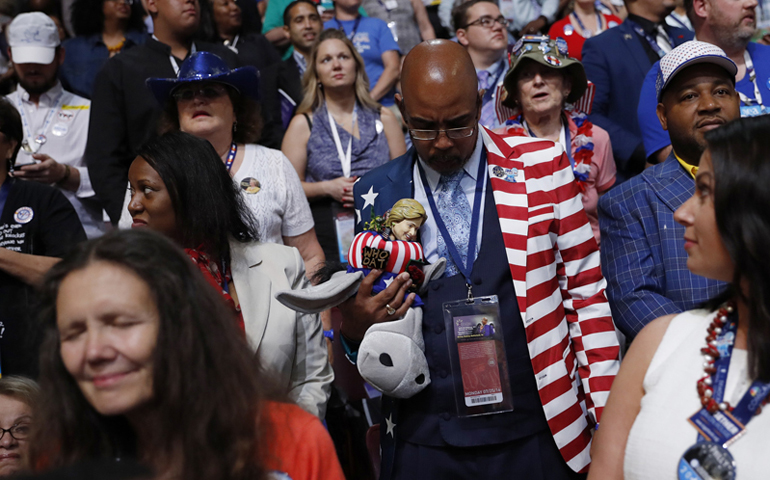 Delegates bow their heads in prayer during the invocation at the start of the first session of the Democratic National Convention in Philadelphia on July 25, 2016. (Photo courtesy Reuters/Mark Kauzlarich).