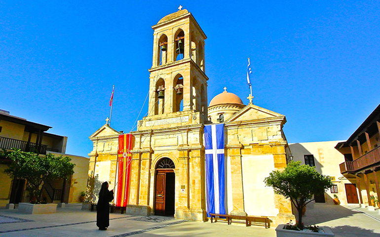 A Greek Orthodox monk rings the bells for vespers at the church of the Gonia monastery in Kolymvari, Crete. The Orthodox Council in June met nearby and held its morning liturgies in this church. Photo taken on June 22, 2016. (RNS/Tom Heneghan)