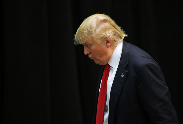 U.S. Republican presidential candidate Donald Trump looks down as he leaves a campaign event in Concord, North Carolina on March 7, 2016. (Reuters/Chris Keane)