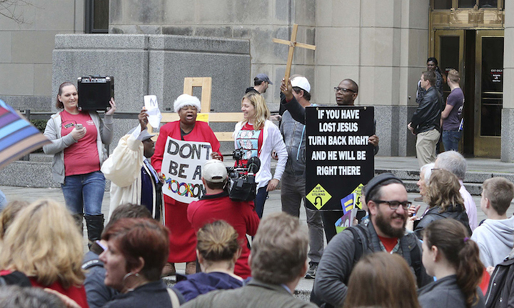 Supporters and opponents of same-sex marriage hold signs on the steps of Jefferson County Courthouse in Birmingham, Ala., on Feb. 9, 2015. (Reuters/Marvin Gentry)