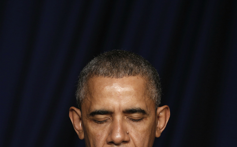 President Barack Obama bows his head in prayer as he attends the National Prayer Breakfast in Washington on Feb. 4, 2016. (Reuters/Kevin Lamarque)