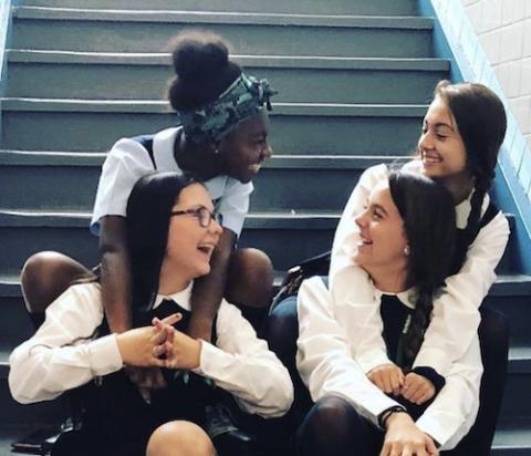 Hallahan students (clockwise from top left) Tajae Henricks, Ava Roberts, Jill Kimrey and Caitlin Siemien sit together on campus.