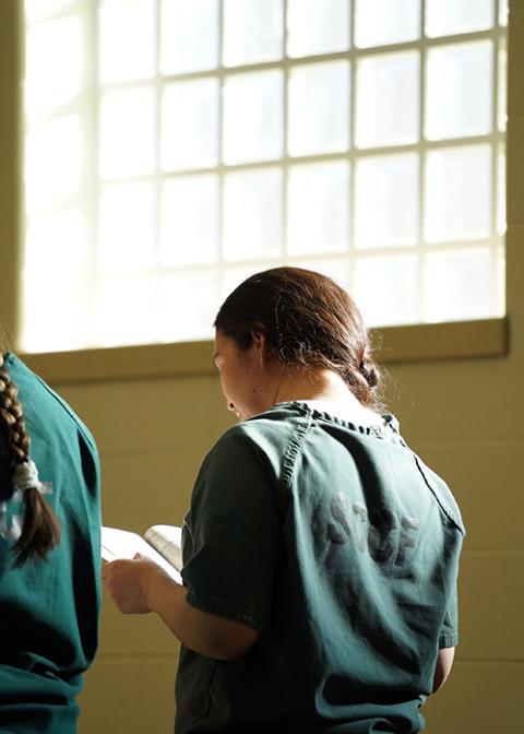 An incarcerated woman sings during a Mass on Dec. 19, 2019, at the Suffolk County Correctional Facility in Yaphank, New York. (CNS/Gregory A. Shemitz)